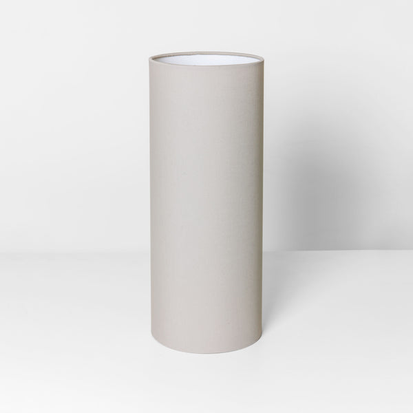Tall cylindrical lampshade in a neutral beige color