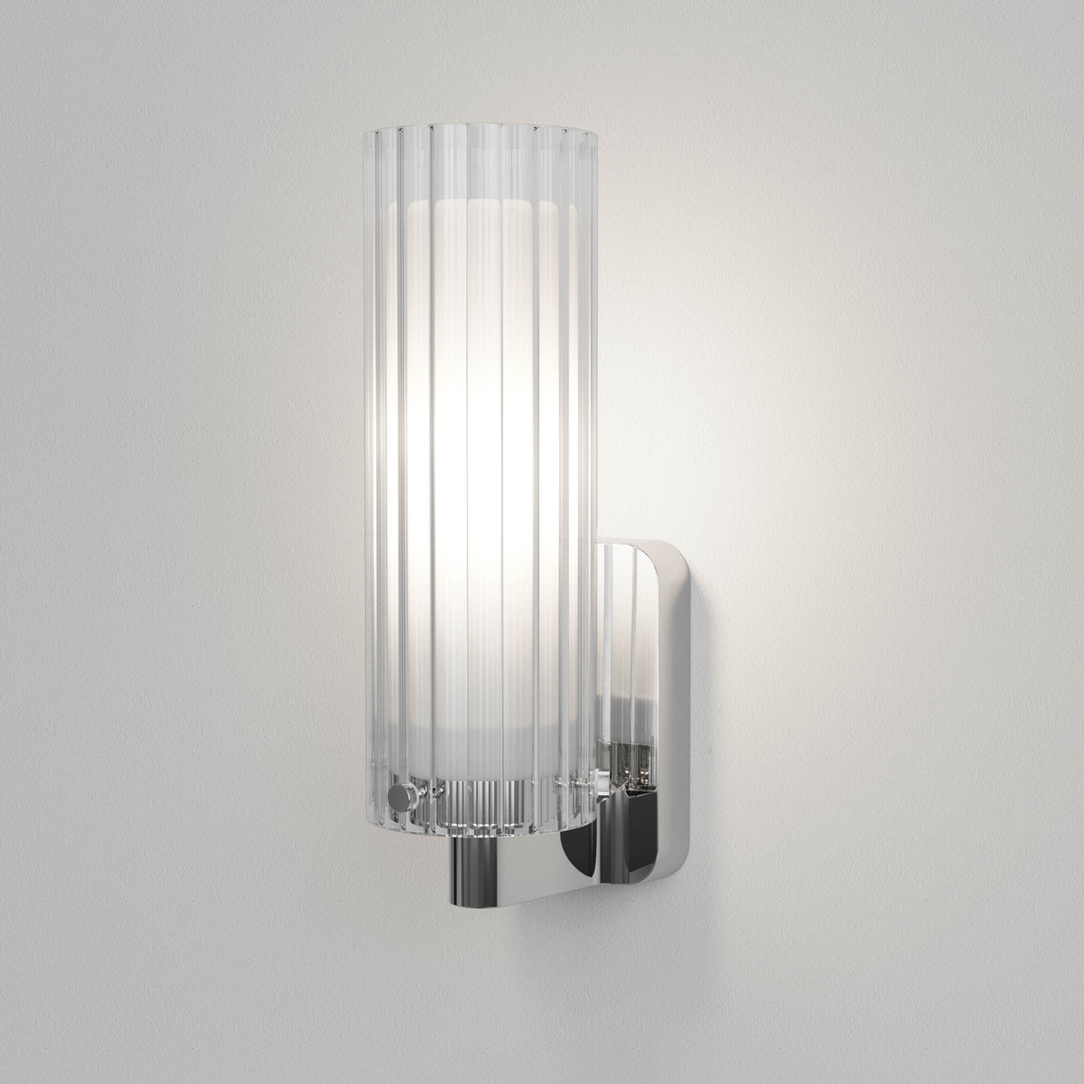 Chrome wall light with a fluted glass shade