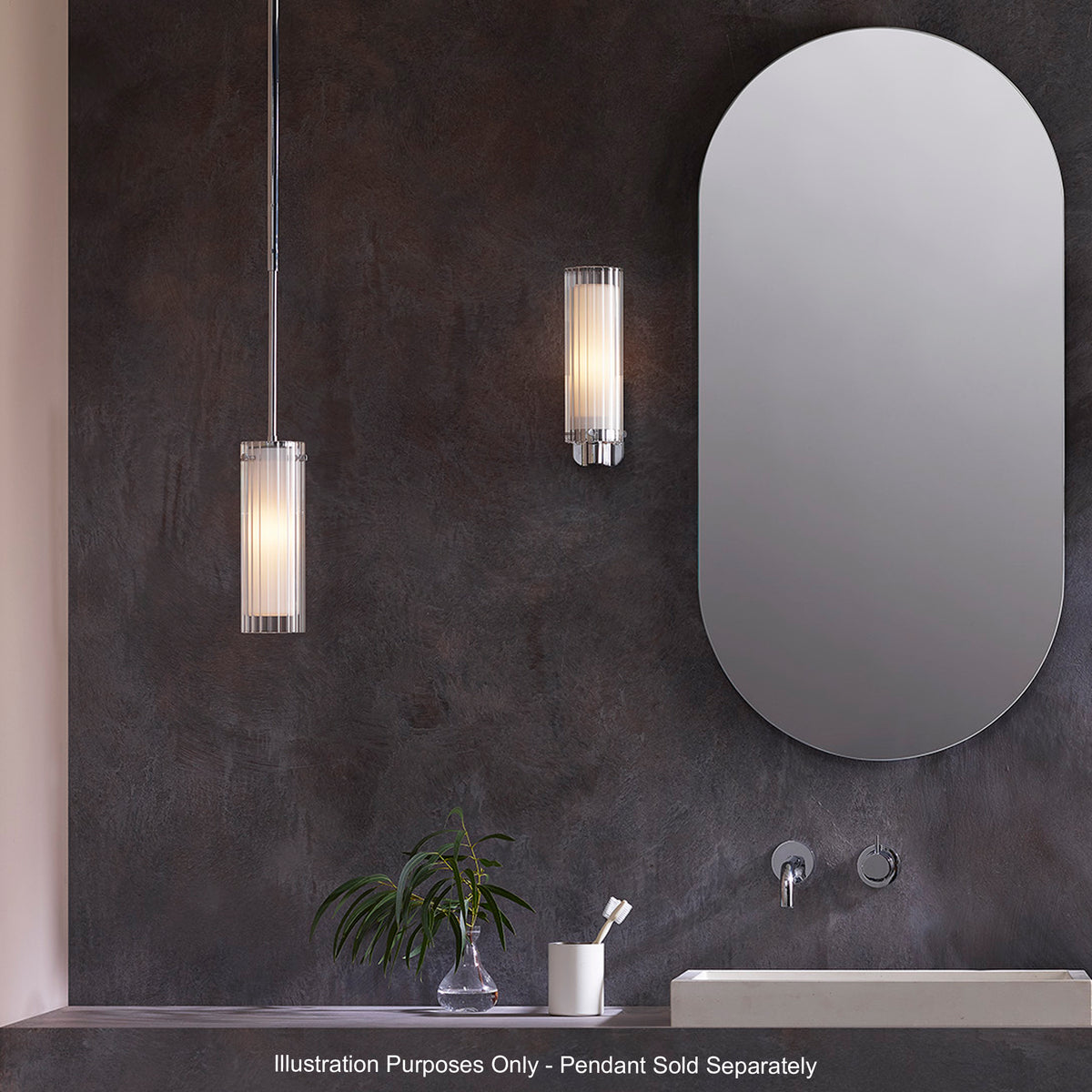 Bathroom with a rectangular mirror, a wall-mounted light, a pendant light, and a sink with a faucet