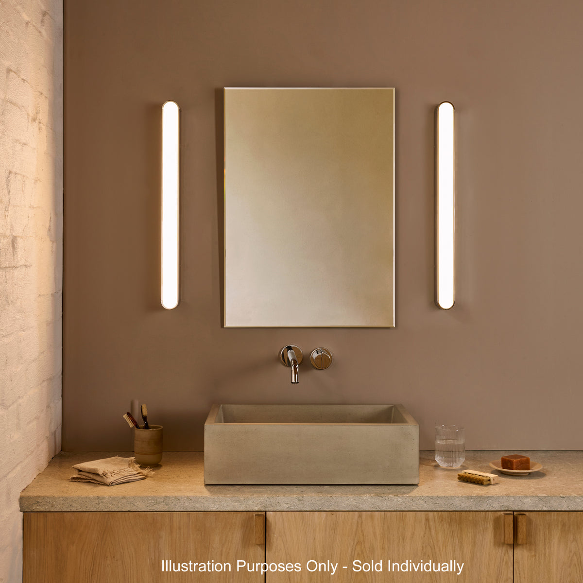 Bathroom vanity with a rectangular concrete sink, a mirror, and two vertical wall lights