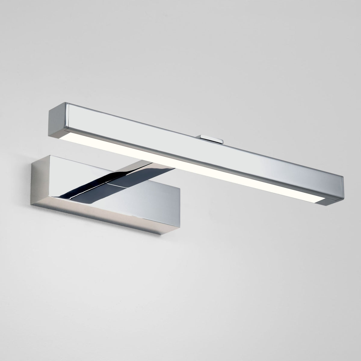 Chrome LED picture light with a rectangular base and a long, thin light bar extending horizontally