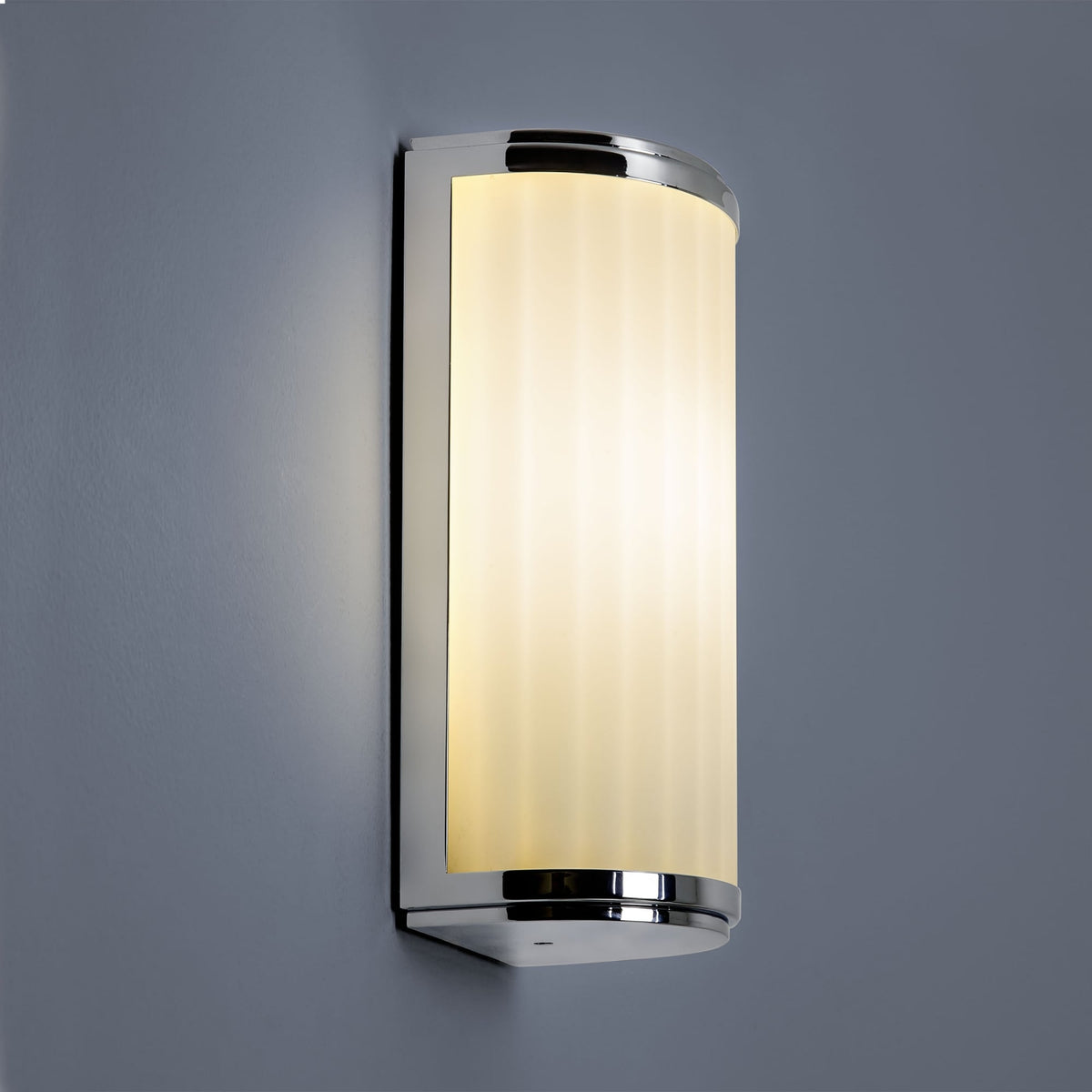 Chrome wall light with a frosted glass shade