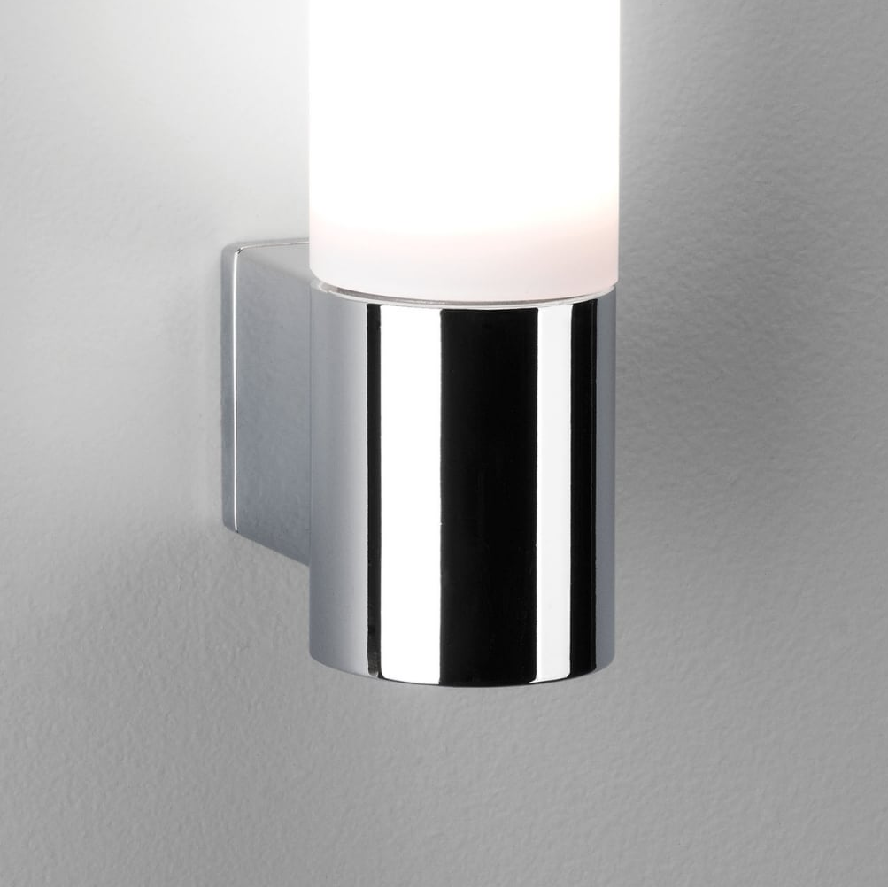Chrome wall light with a cylindrical frosted glass shade