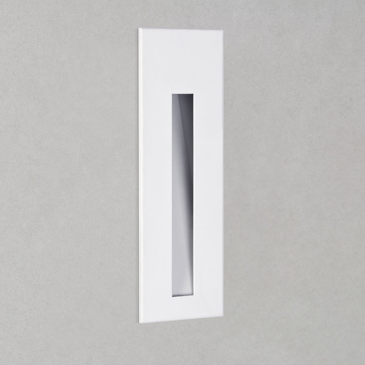 White rectangular wall light with a vertical slot for illumination