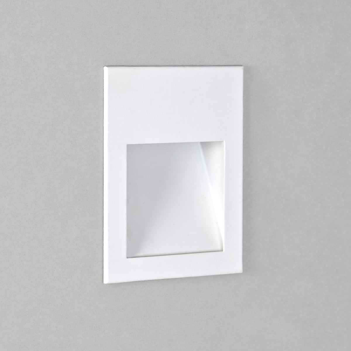 White rectangular recessed wall light with a clear square lens