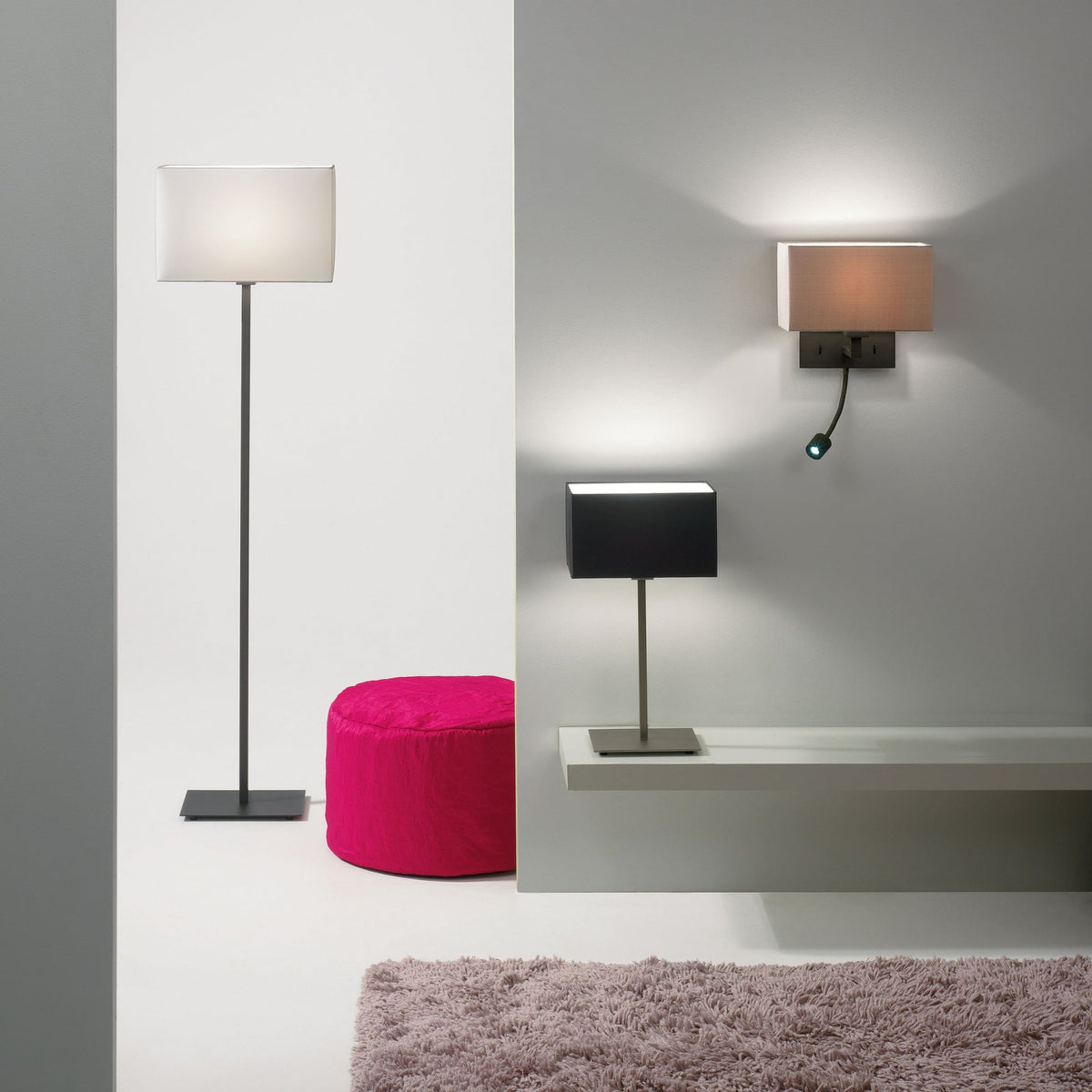 A floor lamp, table lamp, and wall lamp with rectangular shades illuminate a modern room.