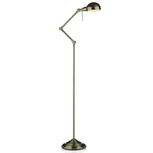 A brushed brass floor lamp with an adjustable arm and dome-shaped shade.