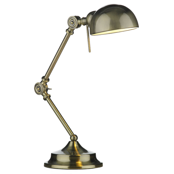 A brass desk lamp with an adjustable arm and a dome-shaped shade.