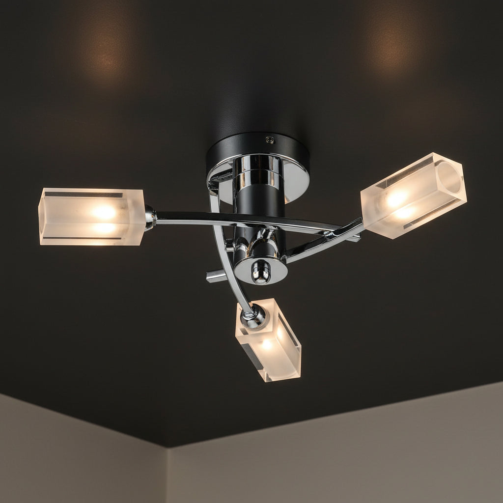 Chrome ceiling light with three rectangular frosted glass shades, each illuminated.