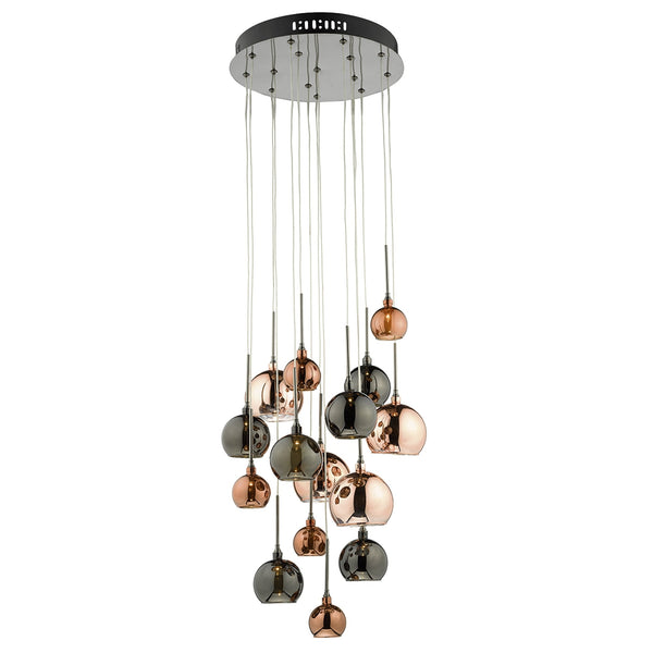A multi-pendant ceiling light with smoked and copper glass shades on a white background.