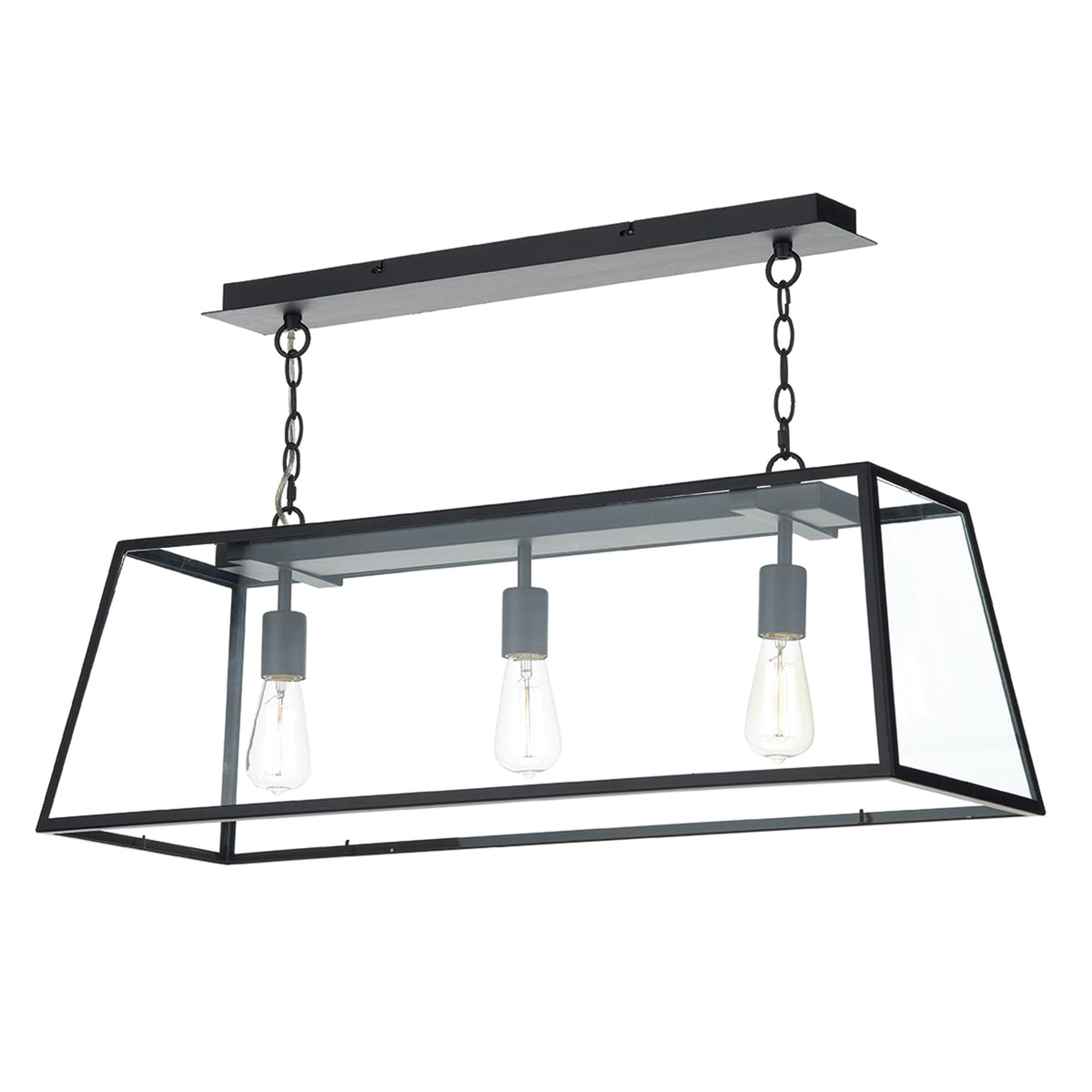Black rectangular pendant light with clear glass panels and three exposed Edison bulbs.