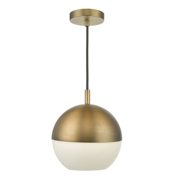 A brass and white spherical pendant light hangs from a black cord.