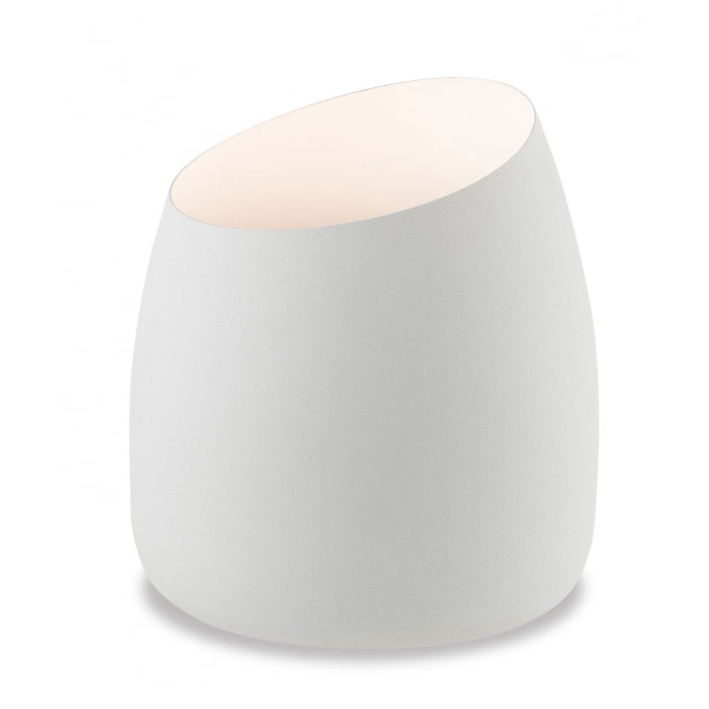 A white, modern, egg-shaped lamp with a slanted top, emitting a soft glow.