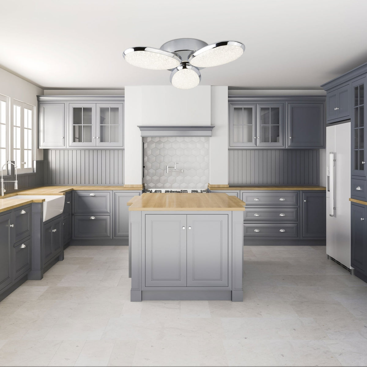 A modern grey kitchen with wooden countertops and an illuminated ceiling light fixture.