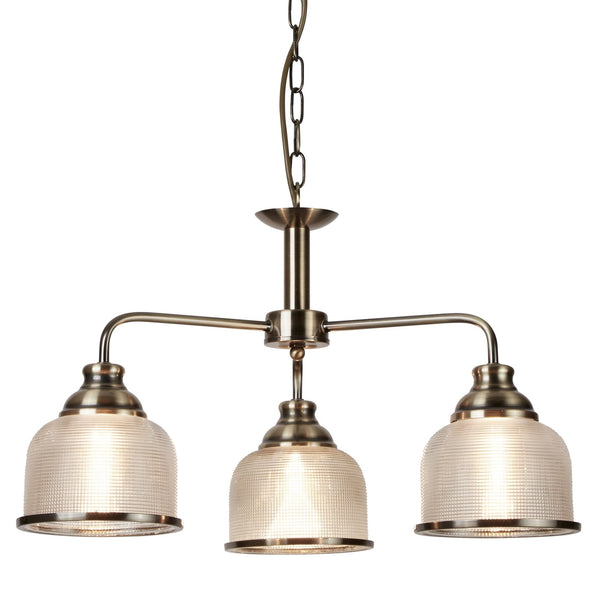 A bronze pendant light with three glass shades.