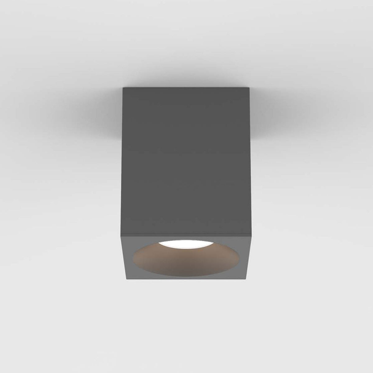Square grey ceiling light with a circular opening and a bright light source