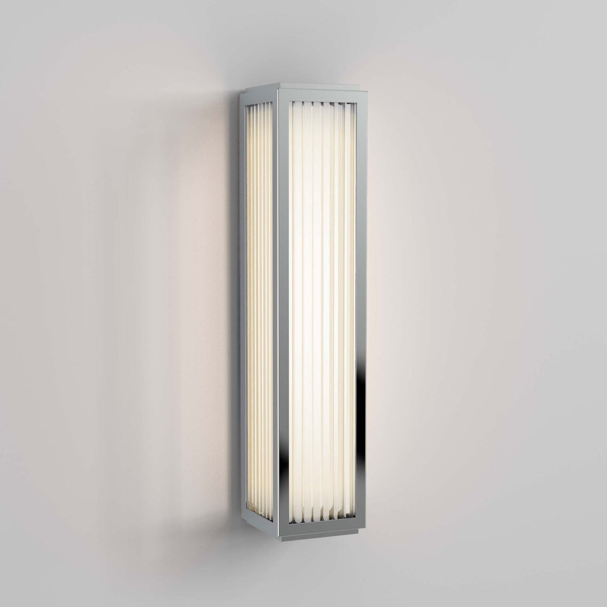 Rectangular wall sconce with chrome frame and vertical ribbed glass panels