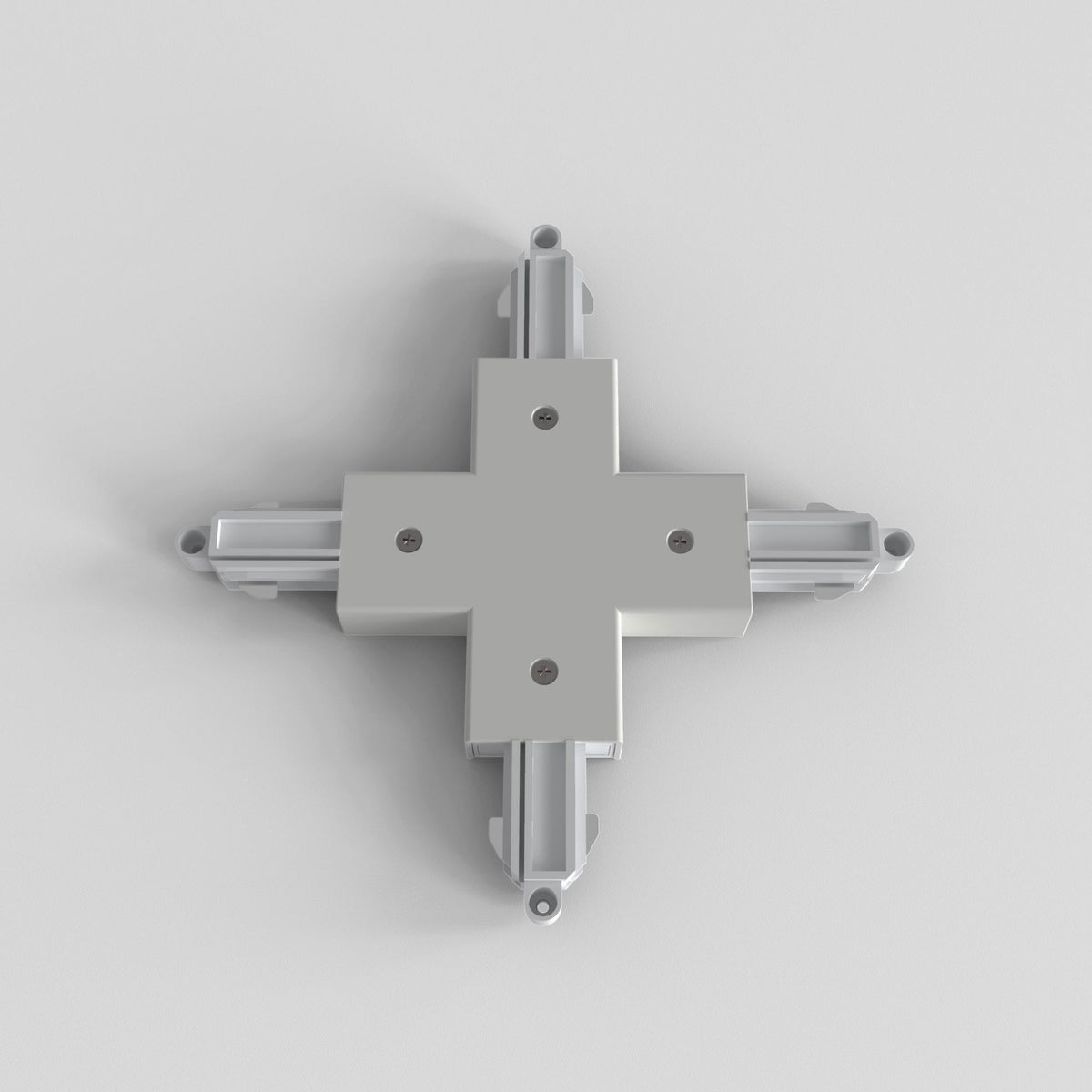 White cross-shaped track lighting connector with four arms extending outwards