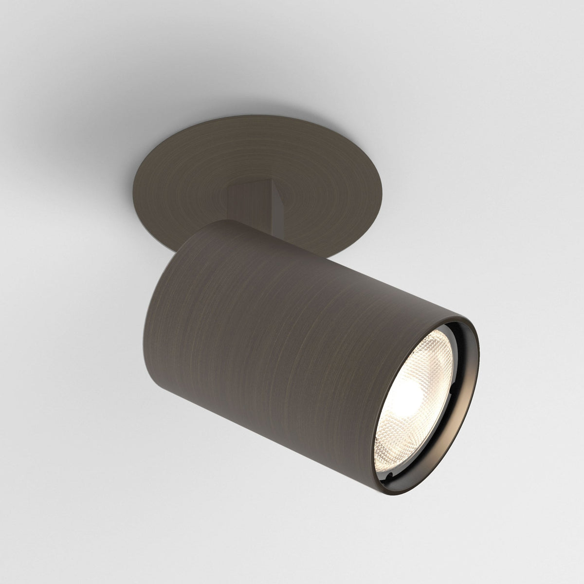 Dark bronze cylindrical ceiling light fixture with a visible bulb, mounted on a white ceiling