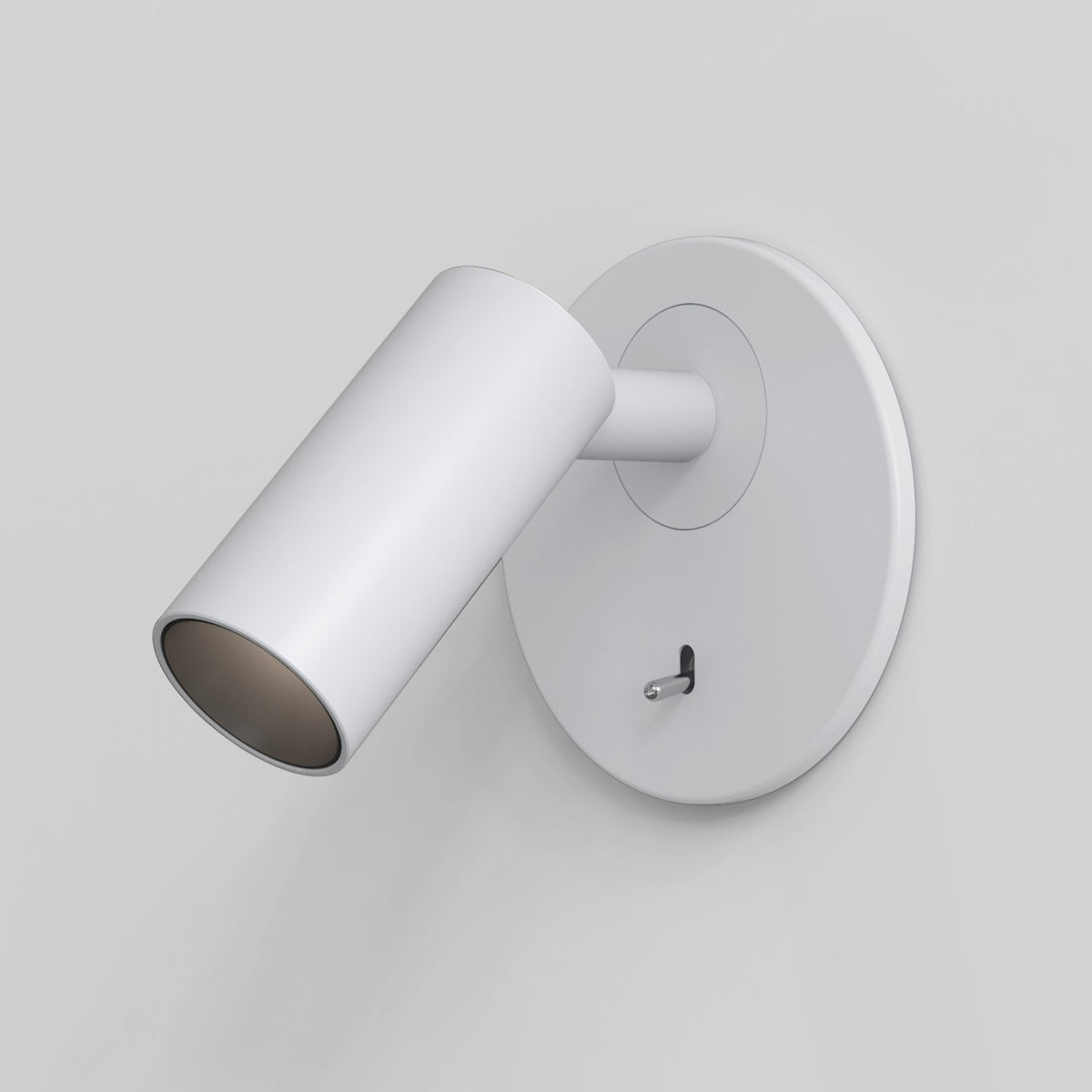 White wall-mounted spotlight with a cylindrical head and a small toggle switch on the circular base