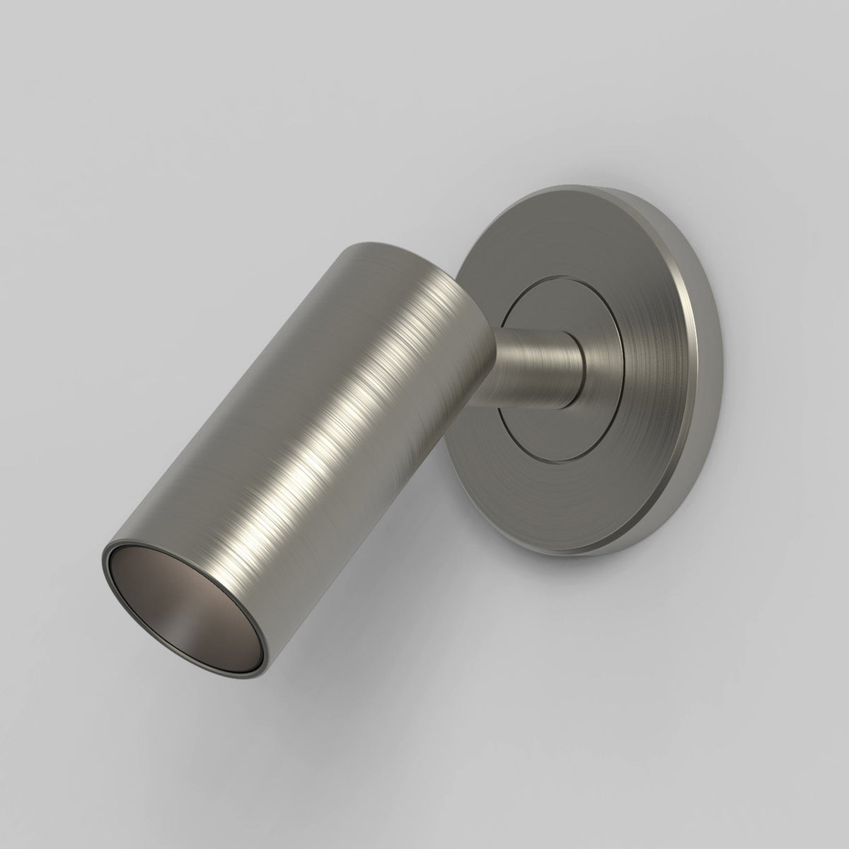 Brushed metal cylindrical wall light with a circular base
