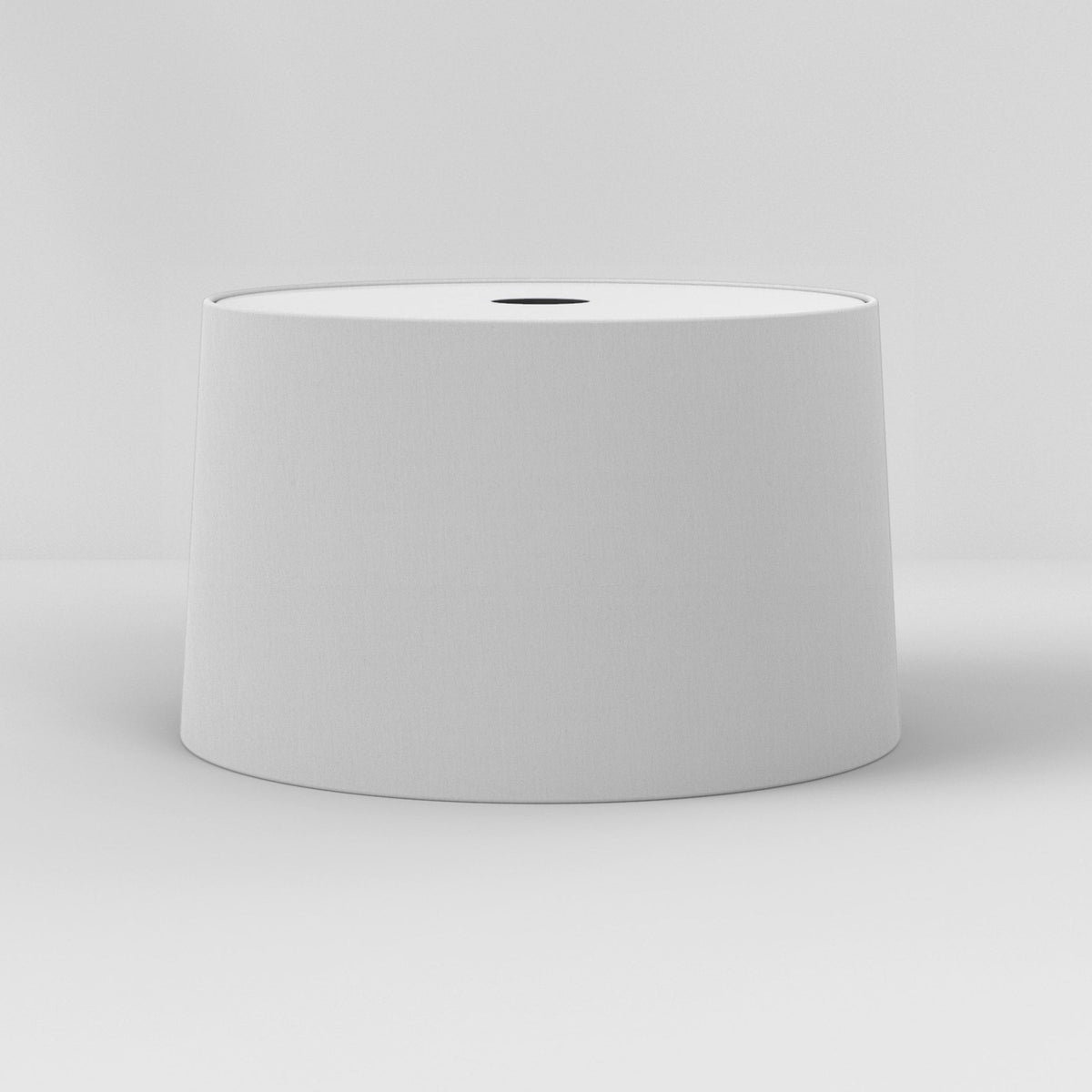 White drum lampshade with a black circular opening at the top