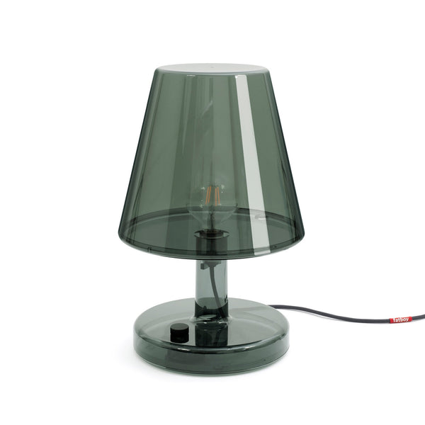 A modern translucent grey table lamp with an exposed bulb and a circular base.
