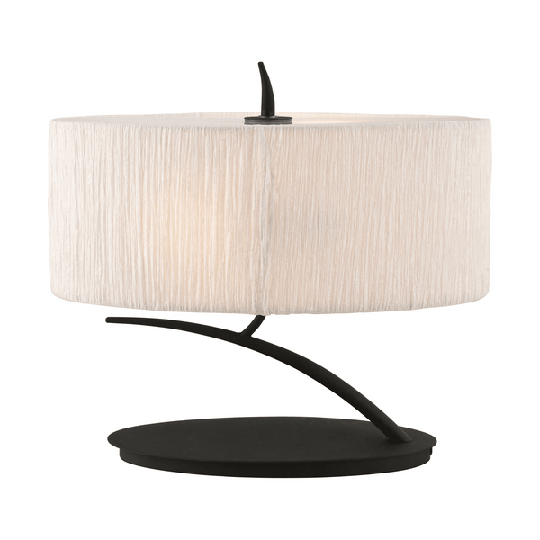 Oval table lamp with a white fabric shade and a curved black metal base.