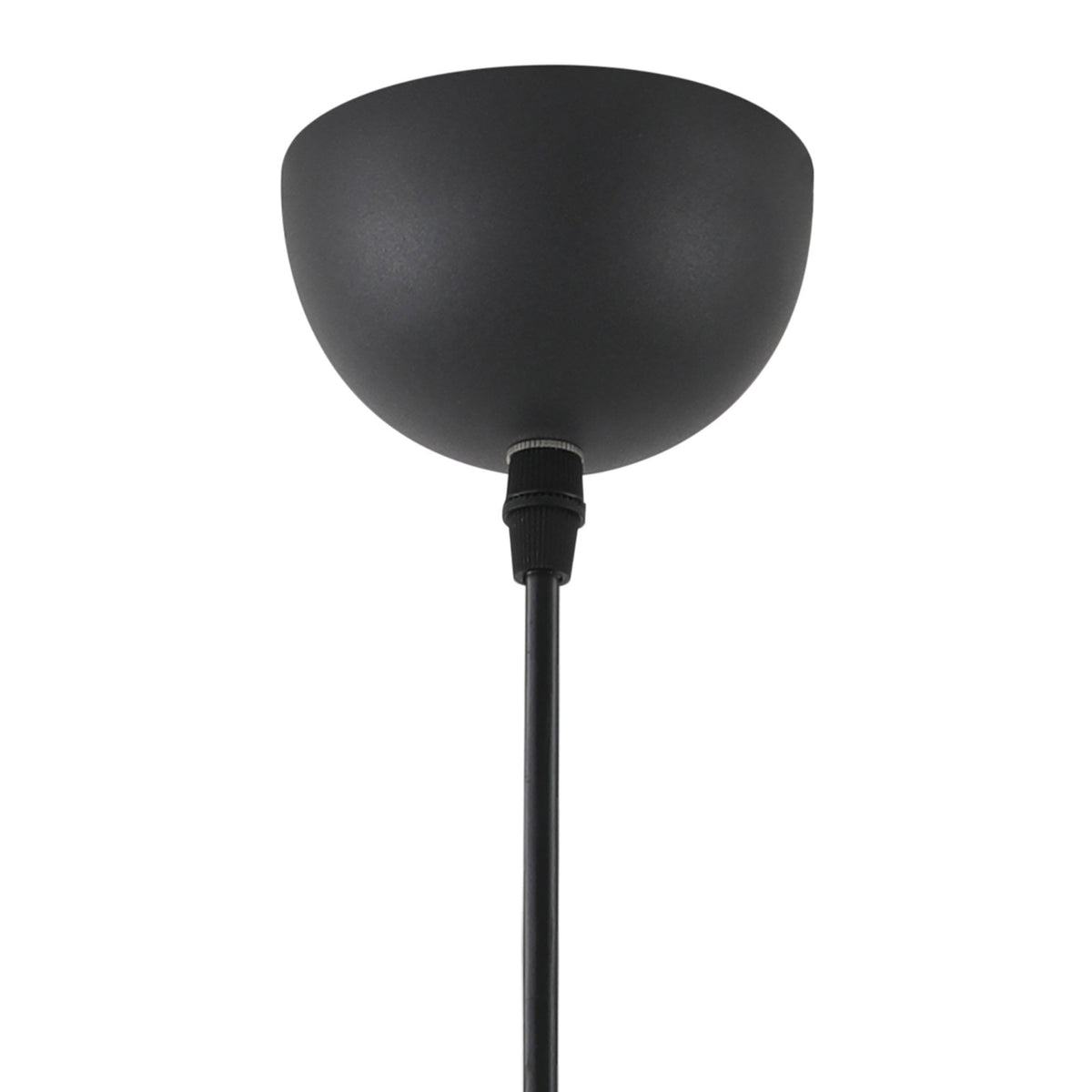 Close-up of the black ceiling rose and suspension cable of a pendant light.