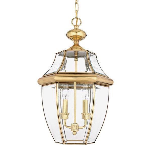 A brass and glass hanging lantern with three candle-style bulbs.