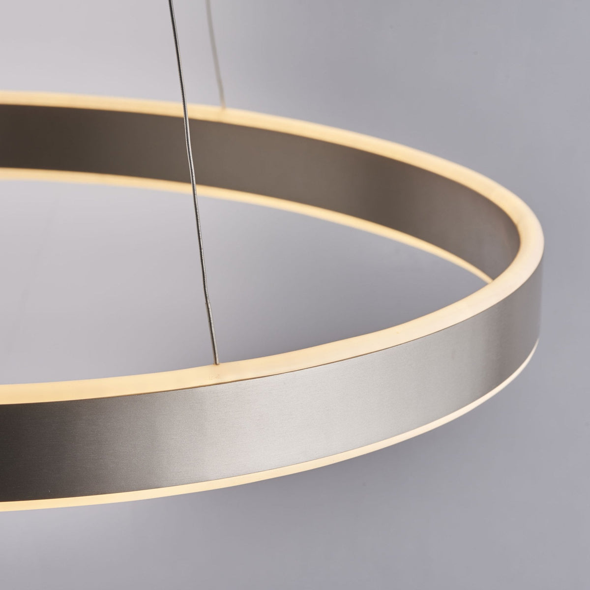 Angled view of a circular LED pendant light, highlighting its sleek design and even illumination.