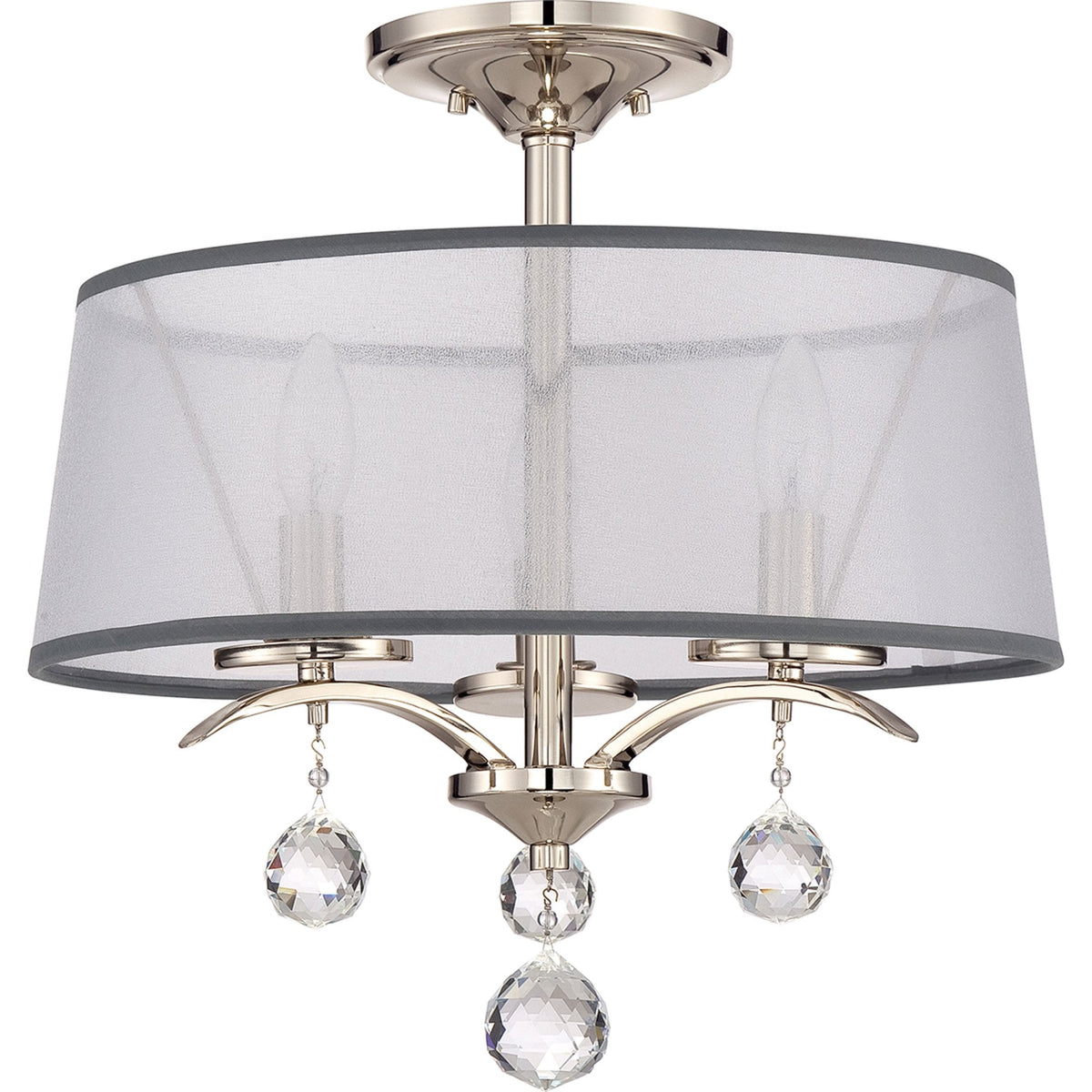 A close-up of a glamorous ceiling light fixture with a sheer drum shade and crystal drops.