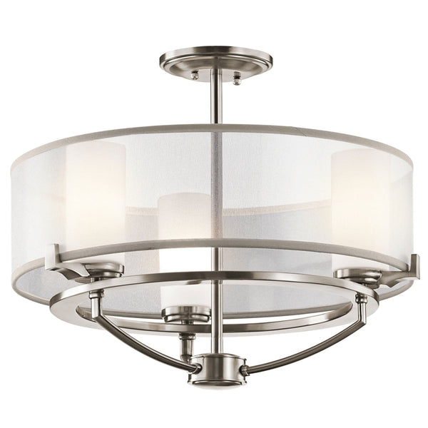 A modern semi-flush ceiling light with a satin nickel frame and a sheer white fabric shade.