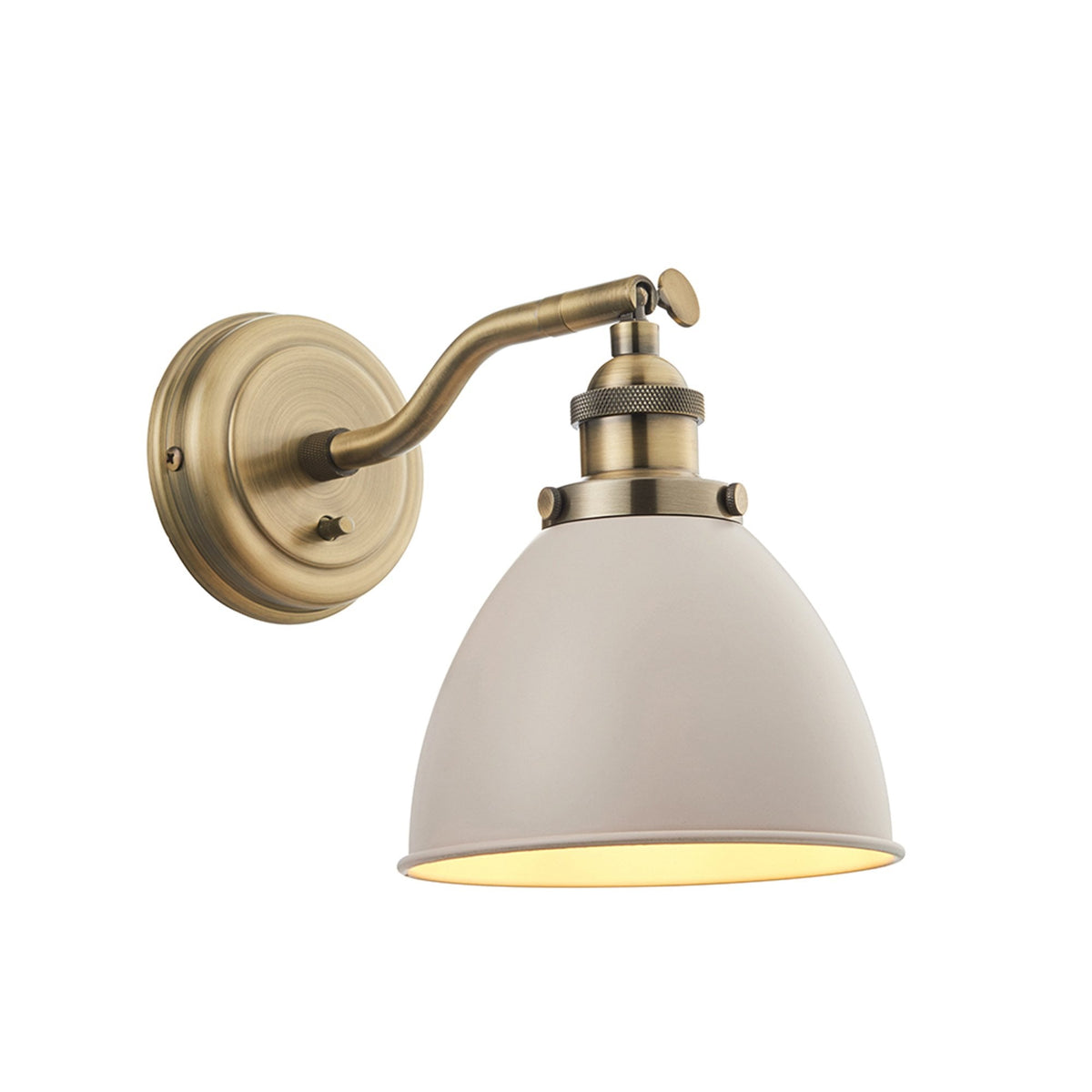 An antique brass wall light with a light grey dome shade, on a white background.