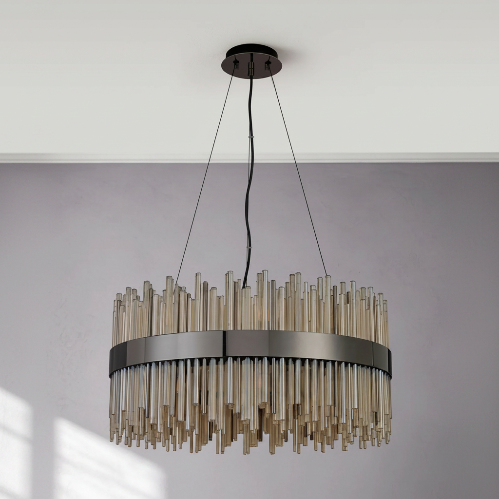 Round chandelier with bronze finish and clear glass rods hanging from a white ceiling