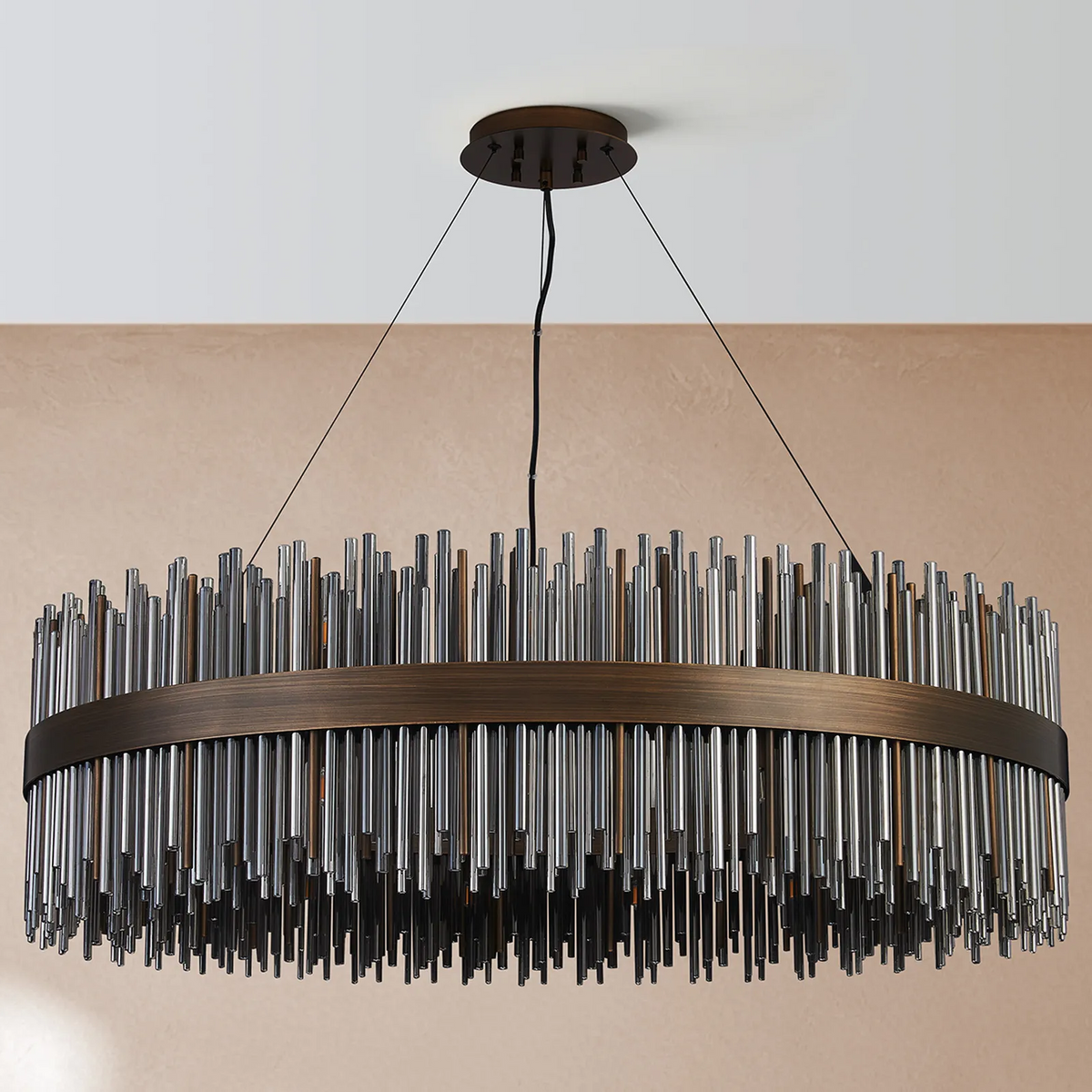 Round chandelier with bronze frame and hanging glass rods in various shades of brown and gray