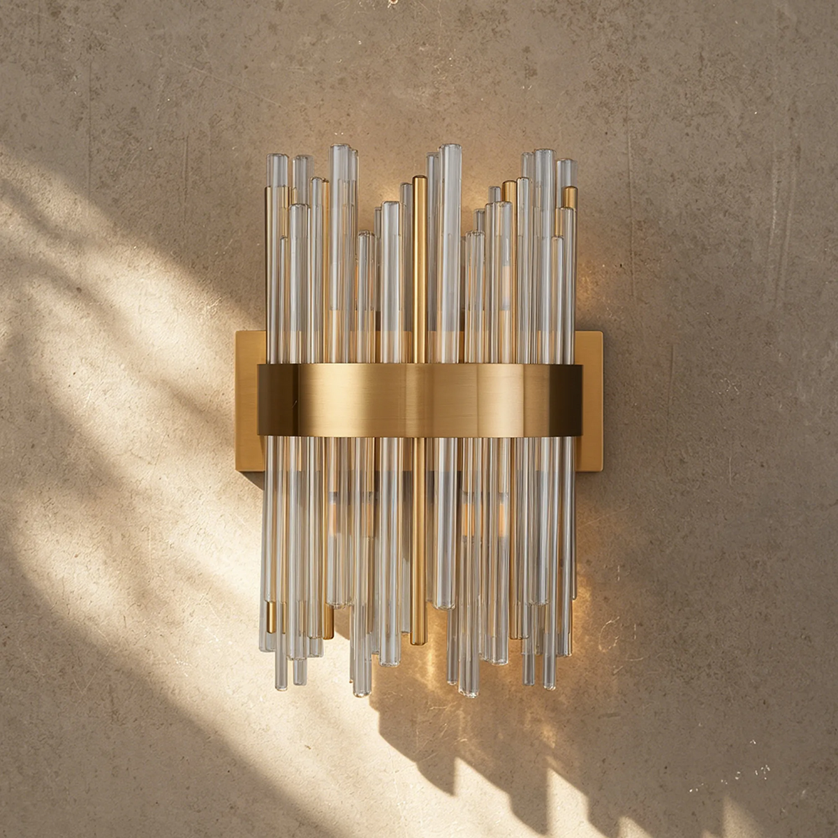 Brass and glass tube wall sconce