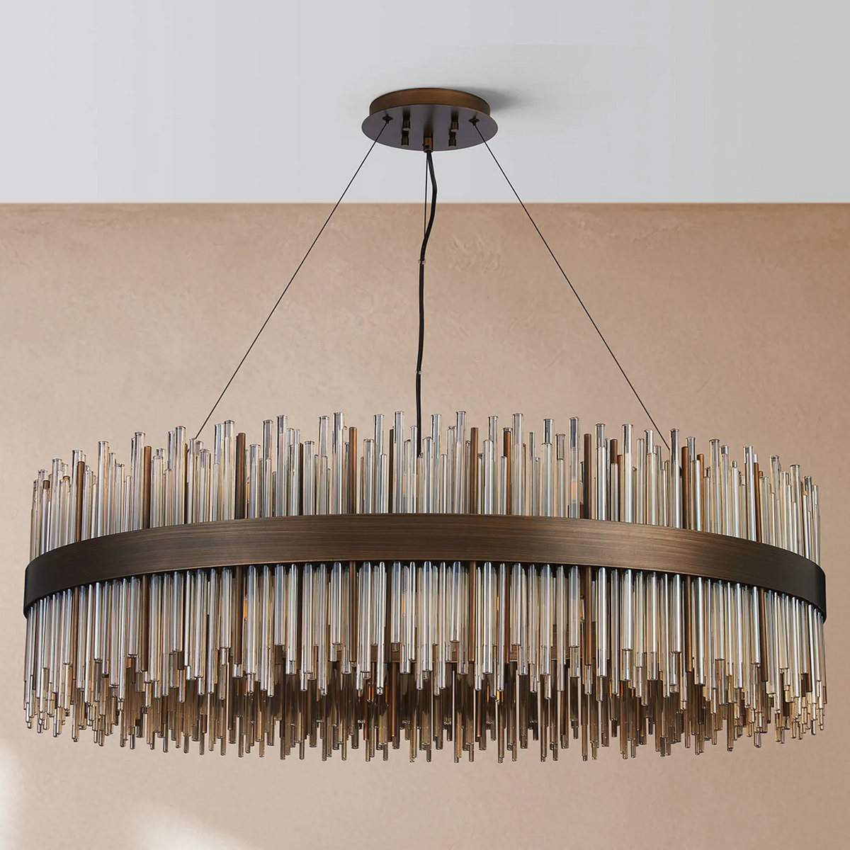 Round chandelier with bronze frame and clear glass rods hanging at varying lengths