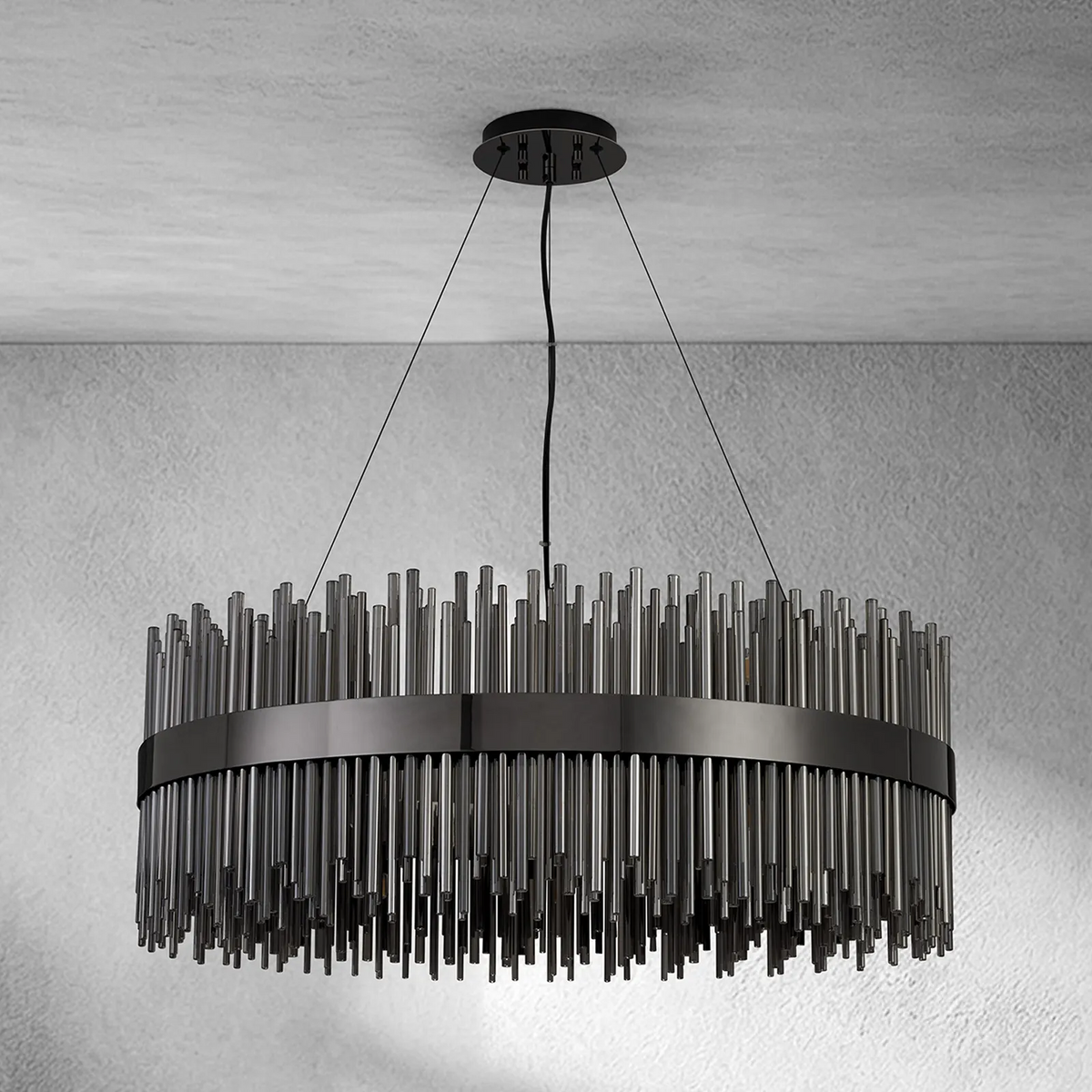 Round chandelier with black metal frame and numerous vertical glass rods hanging from it