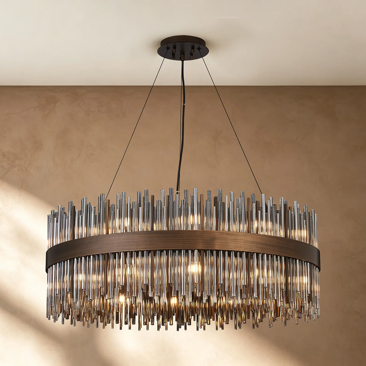 Oval chandelier with bronze frame and clear glass rods