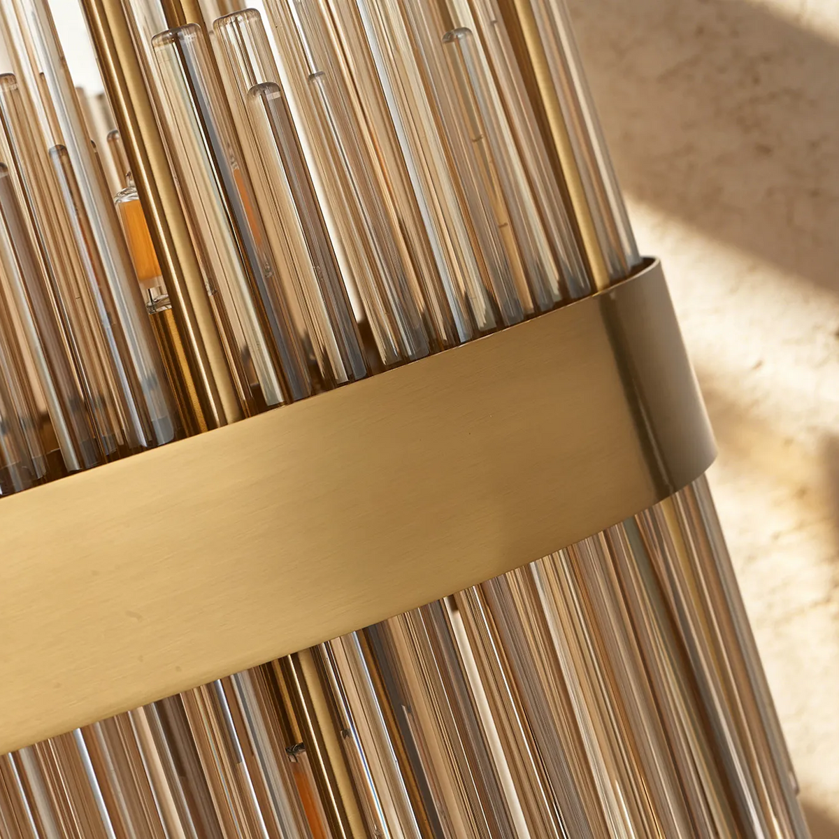 Close up of a gold chandelier with glass rods