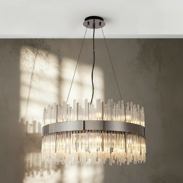 Round chandelier with clear glass rods and a polished metal band