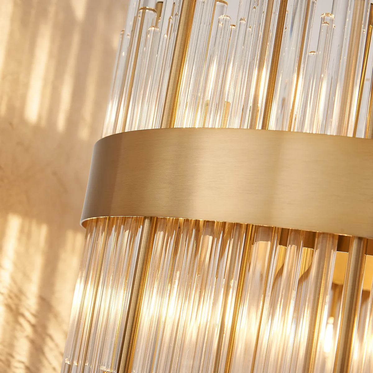 Close up of a gold and glass wall light