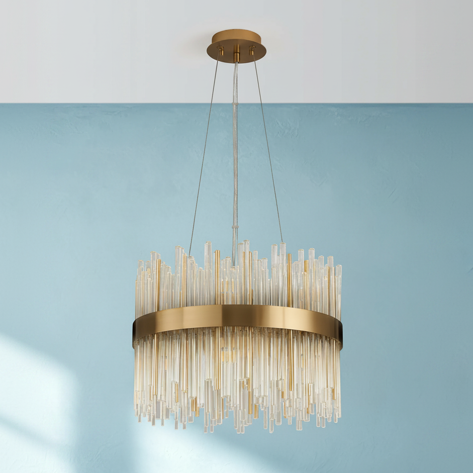 Round chandelier with a gold frame and clear glass rods hanging from the ceiling