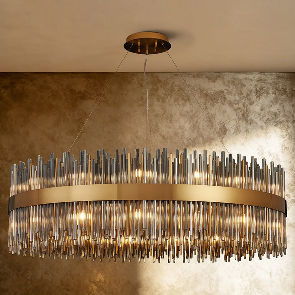 Oval chandelier with a gold frame and clear glass rods