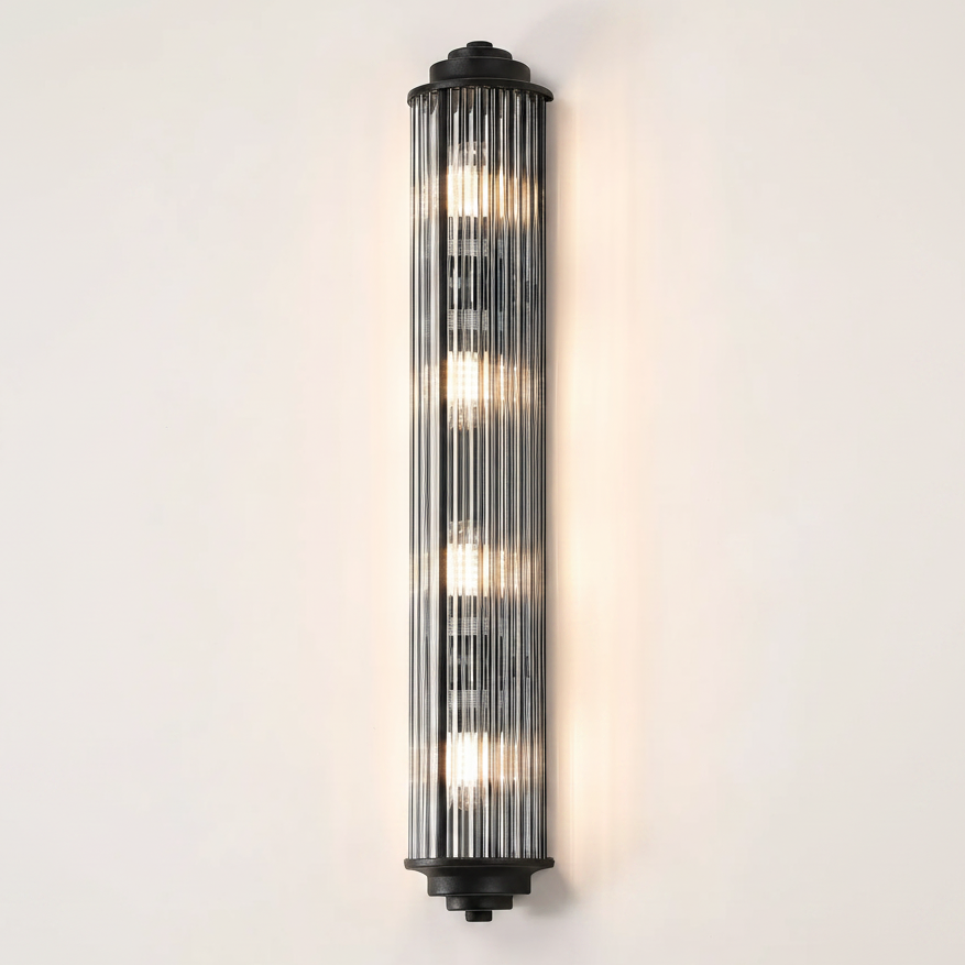 Vertical fluted glass wall light with black metal accents