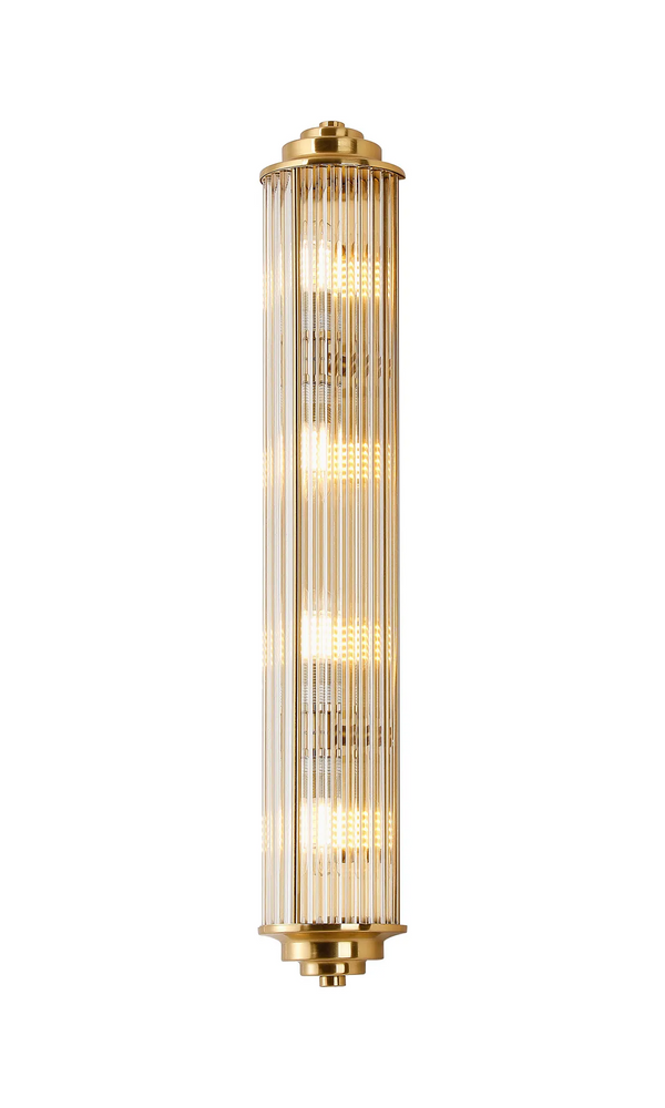 Vertical brass and glass wall sconce with fluted glass rods and four illuminated bulbs