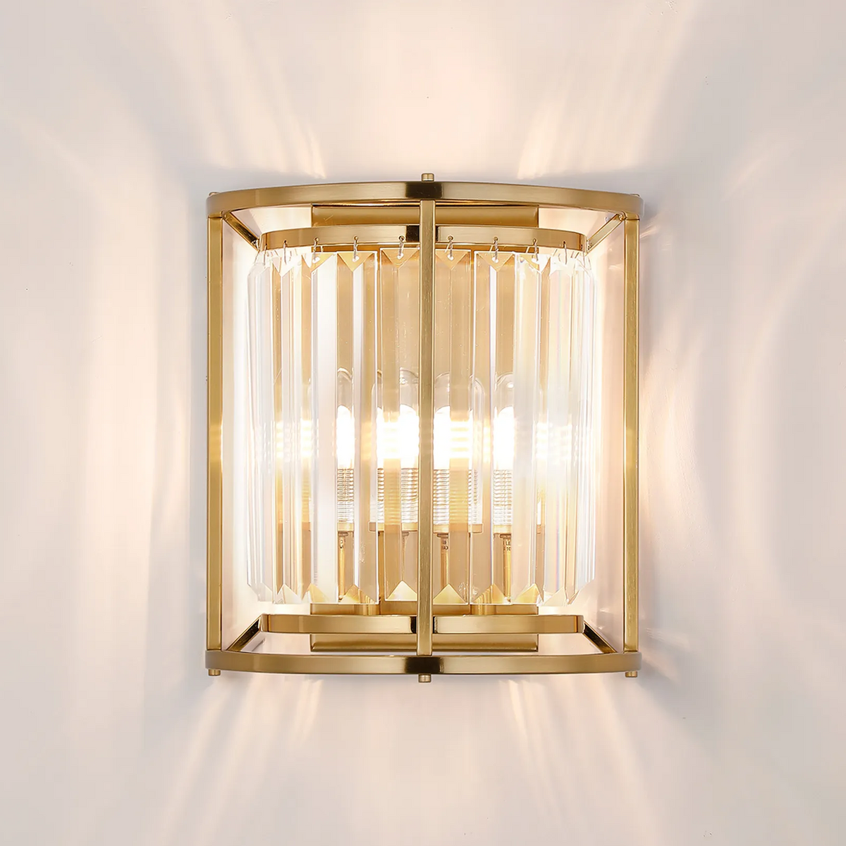 Gold wall sconce with clear crystal rods