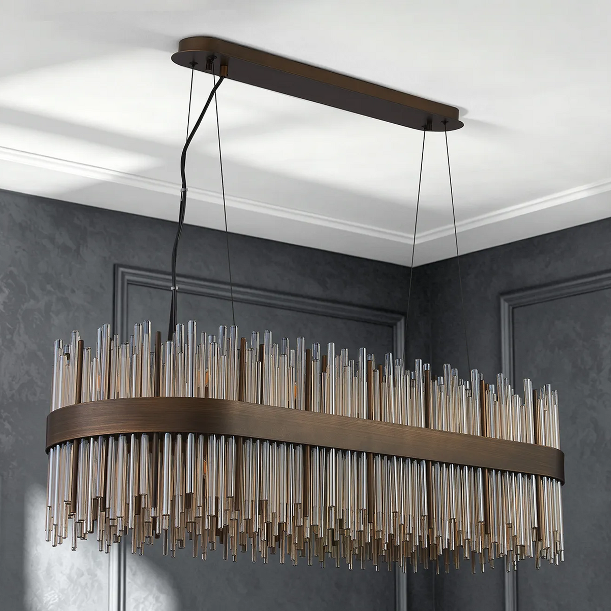 Rectangular chandelier with bronze frame and numerous clear and amber glass rods hanging below