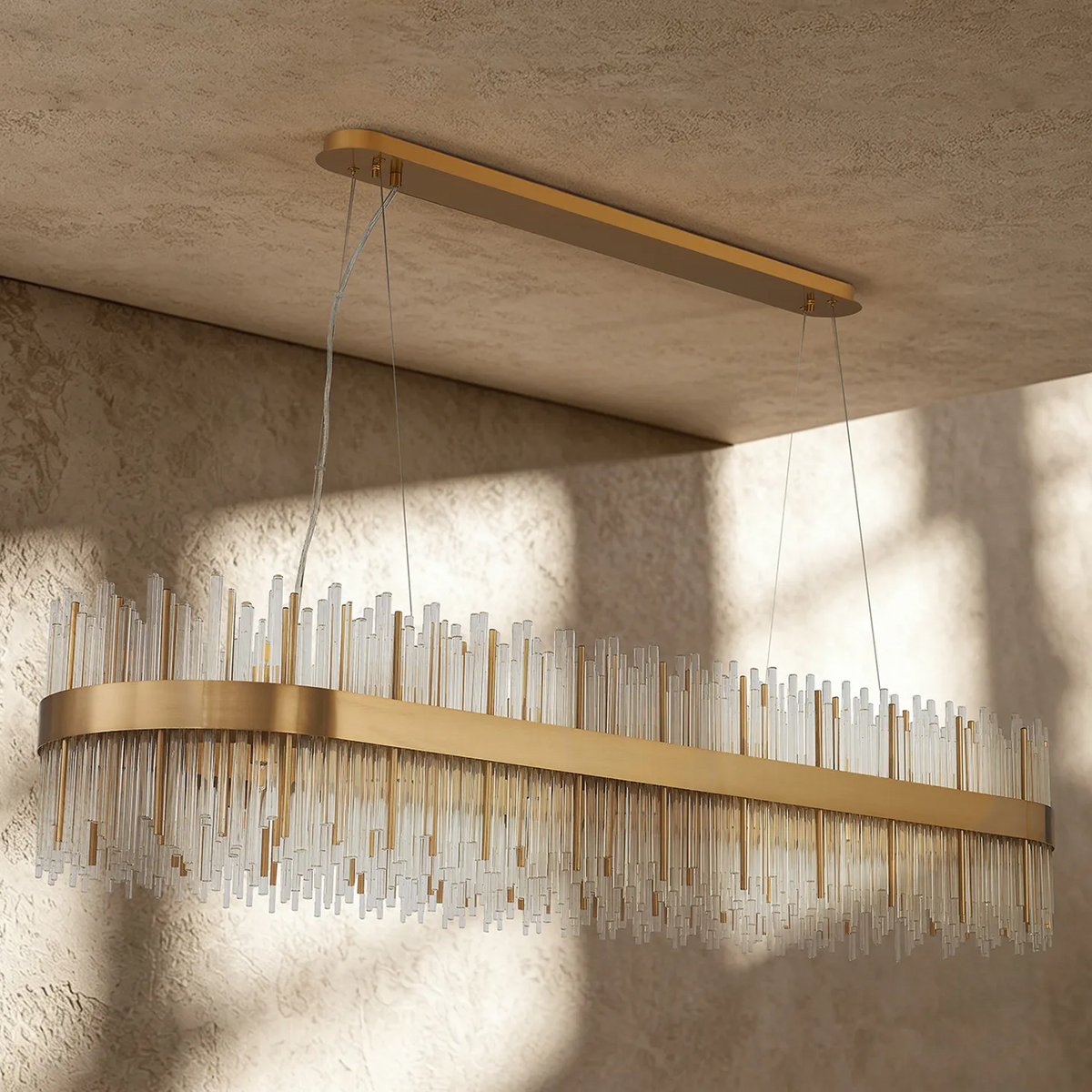 Rectangular chandelier with a gold frame and clear glass rods of varying lengths